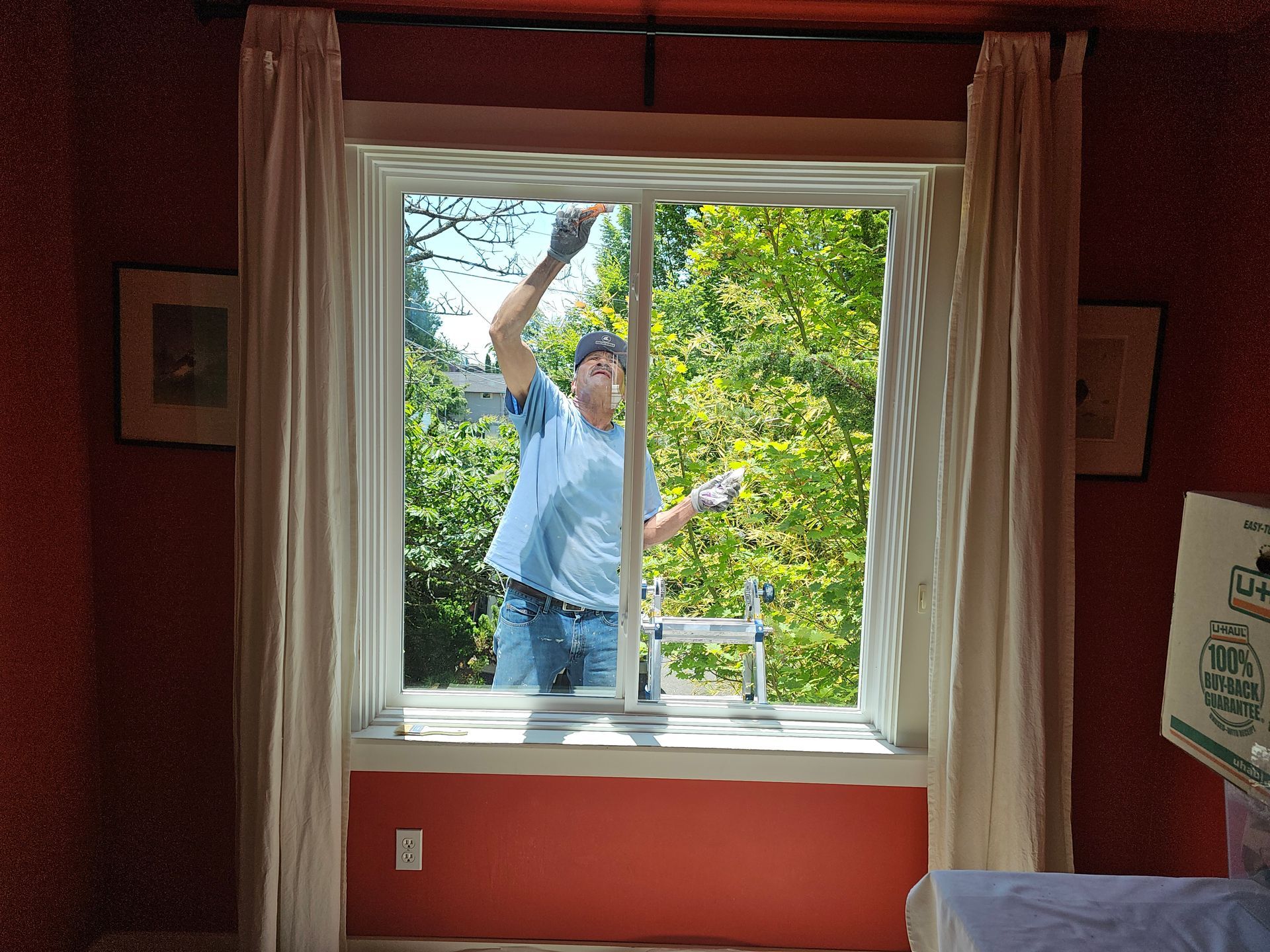A man is fixing a window with a screwdriver.
