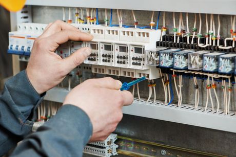 Electrician Fixing Circuit Board - Griffiths Innovative Electrical, Anna Bay NSW