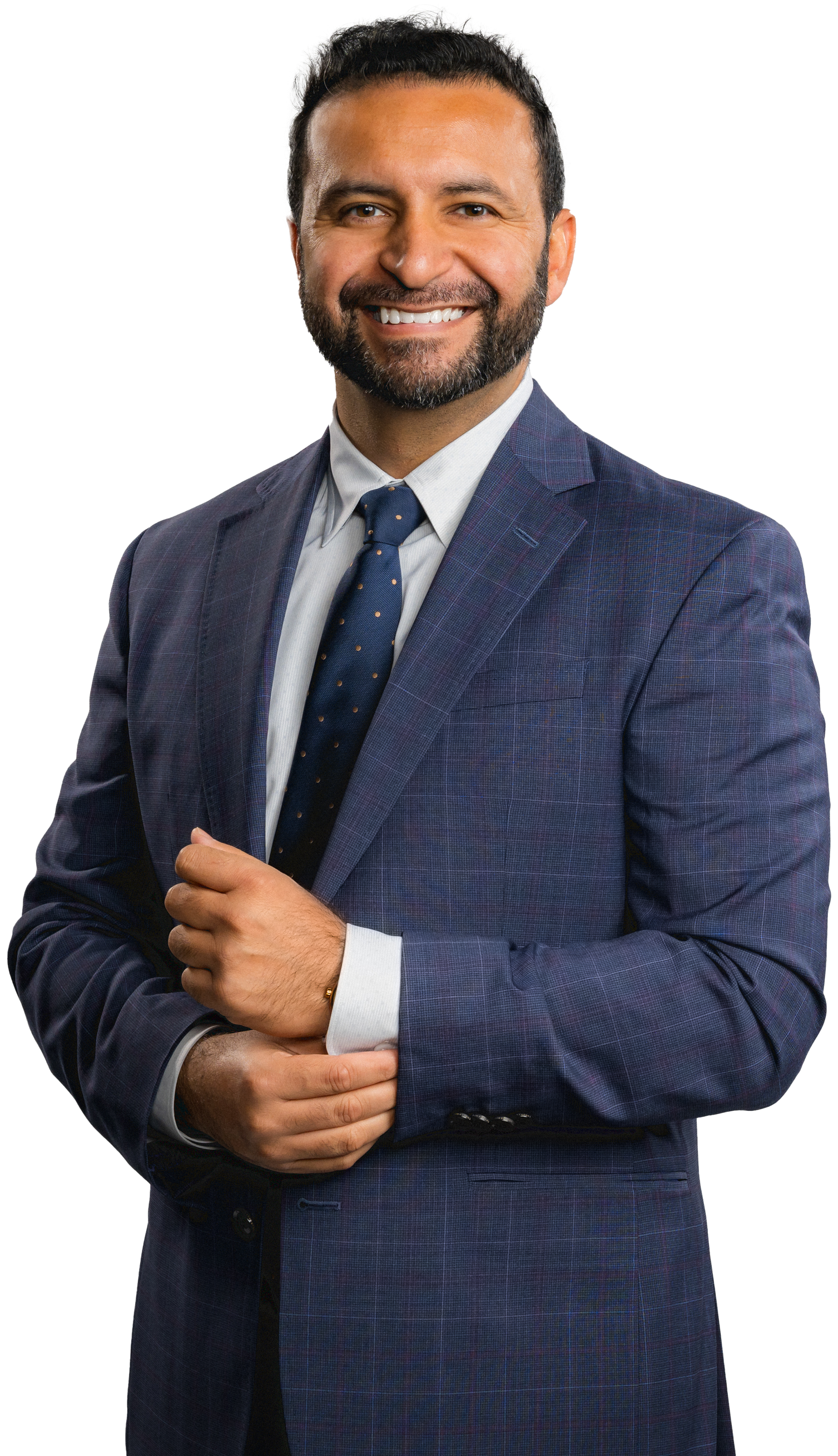 A man in a suit and tie is smiling for the camera.