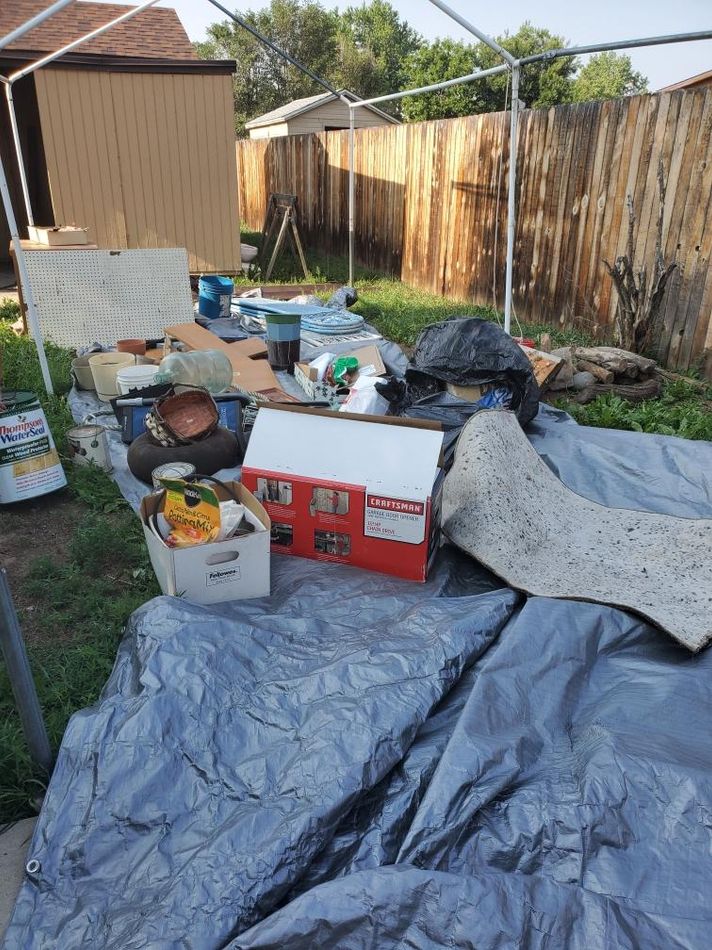 a pile of junk in a backyard in colorado springs