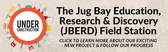 Under construction sign for The Jug Bay Education, Research & Discovery (JBERD) Field Station with orange tools icon
