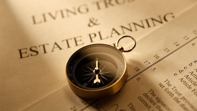 compass on paper that says estate planning