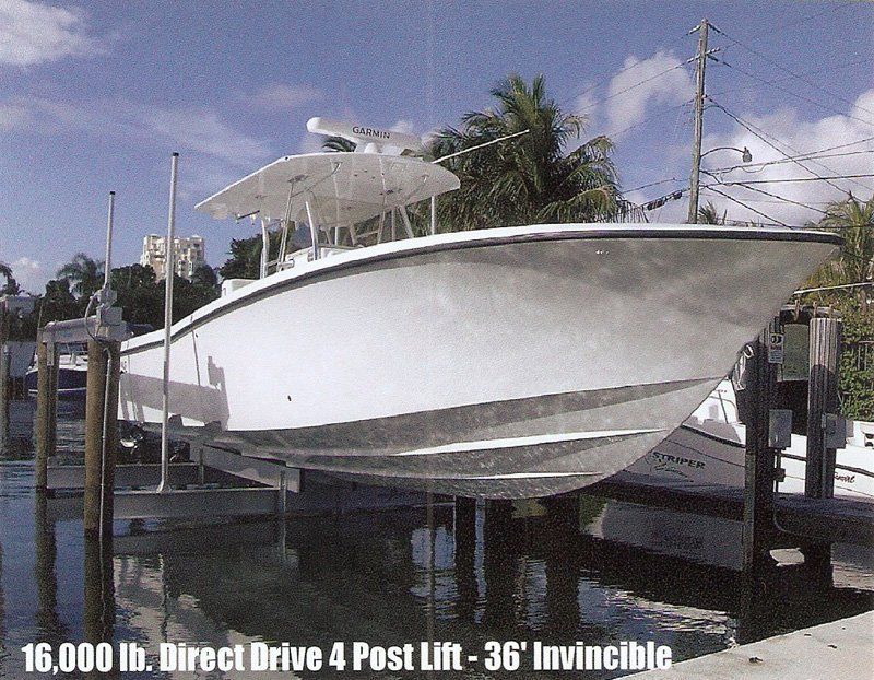Boat Elevators — White Boat in Lift in Miami, FL