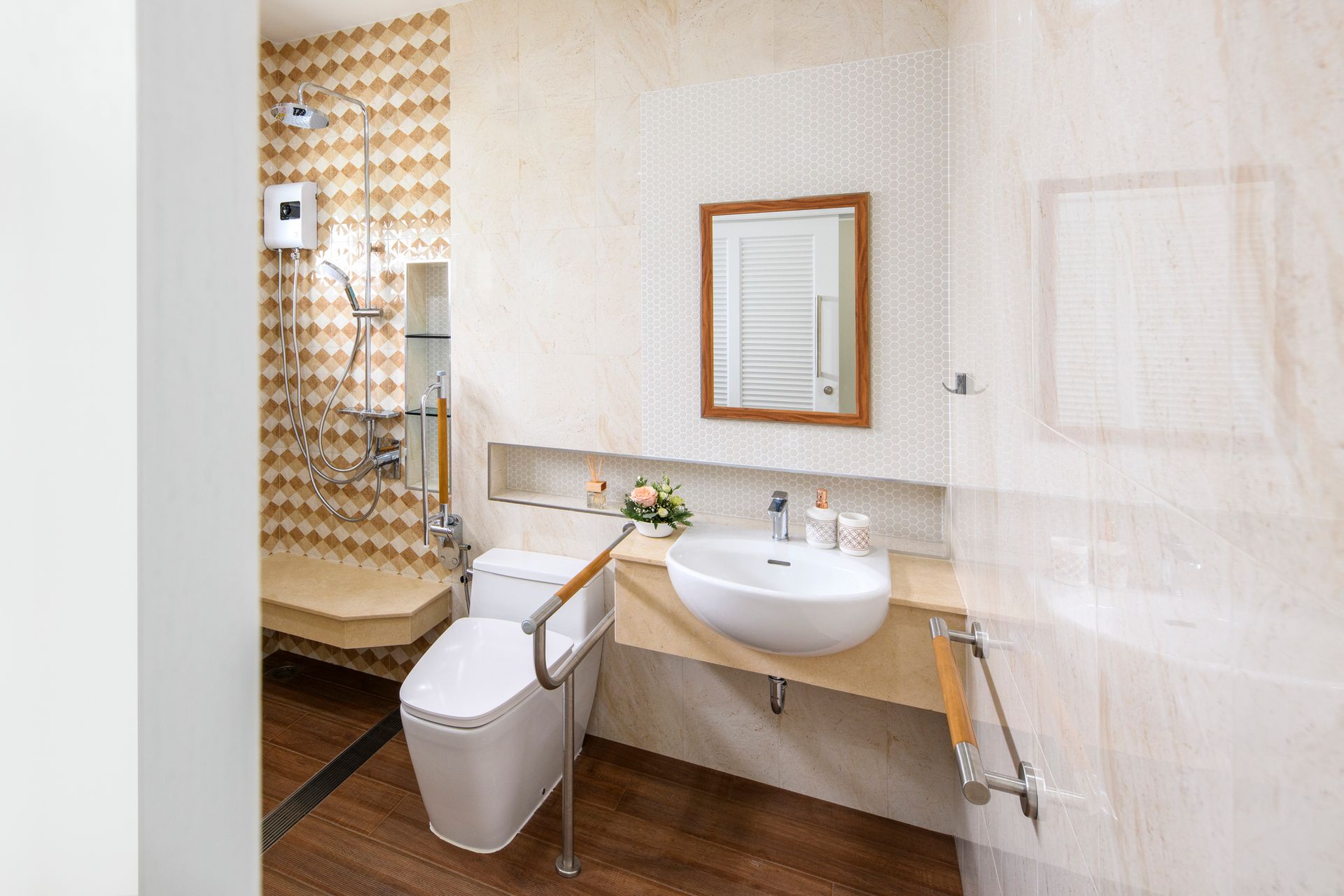 Accessible bathroom with toilet, sink, shower, and grab bars; light brown, beige, and wood tones.