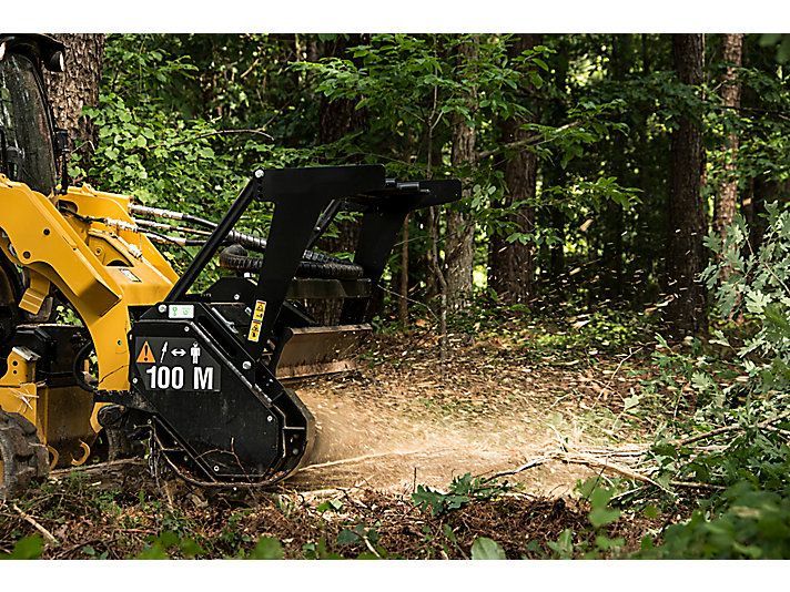 CAT skid steer (with mulcher and slasher attachments)