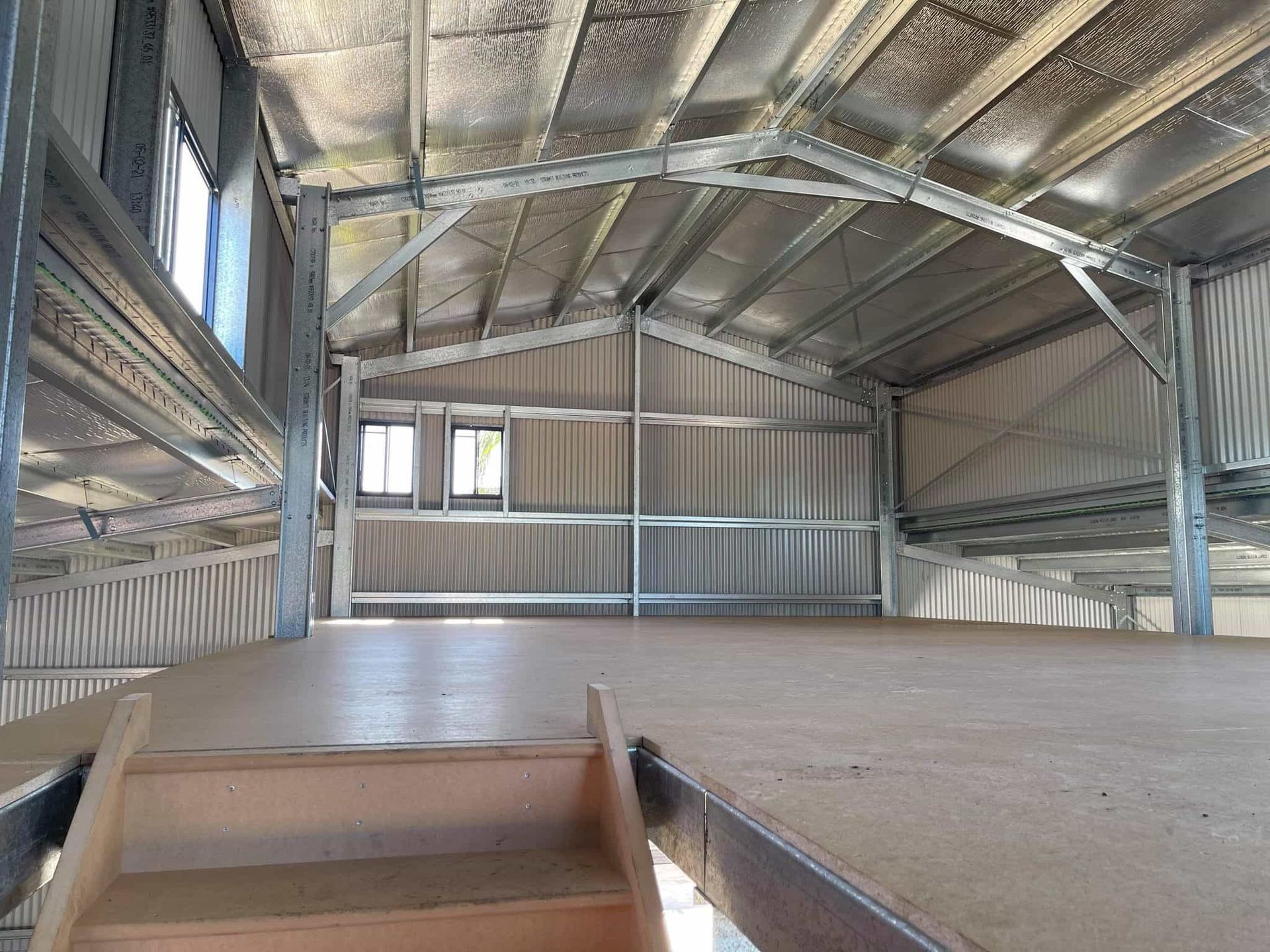 There is a staircase leading up to the second floor of a building. — Just Sheds In Sunshine Coast, QLD