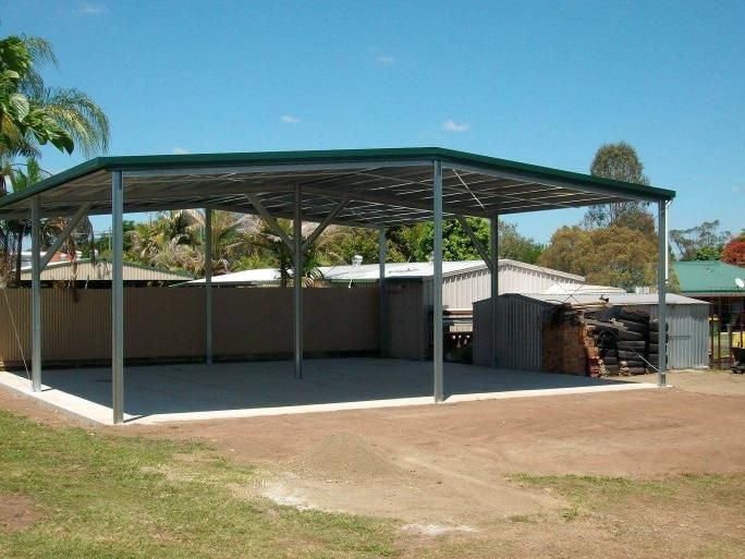 A Carport With A Green Roof And A Fence In The Background — Just Sheds In Gympie, QLD