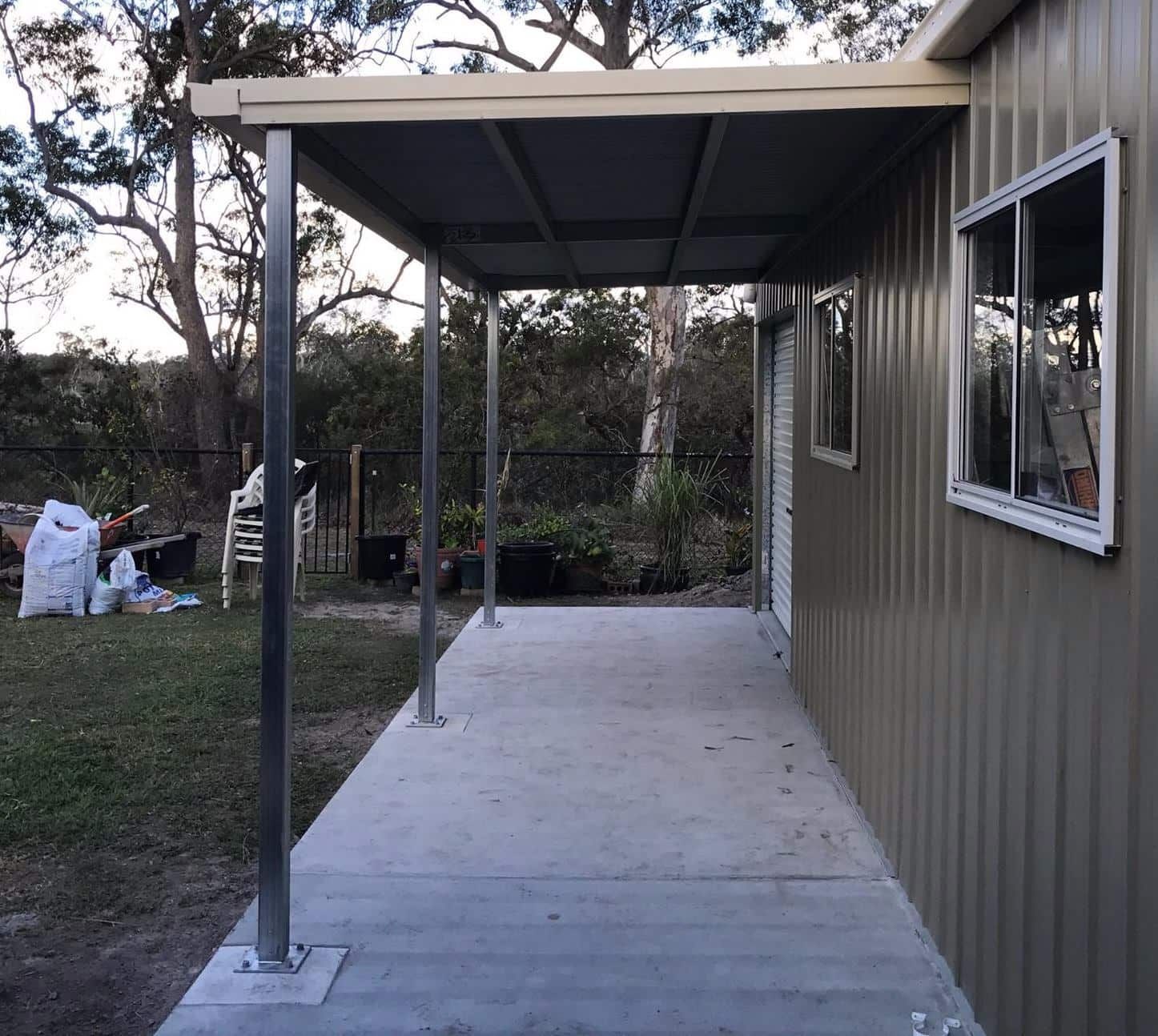 A House With A Covered Porch And A Window — Just Sheds In Kunda Park, QLD