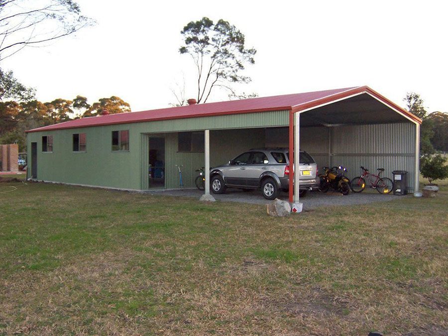 A Car is Parked Under a Shed With a Red Roof — Just Sheds In Kunda Park, QLD