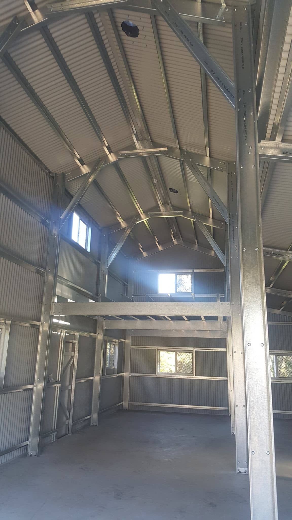 The inside of a building with a lot of windows and a ceiling. — Just Sheds In Kunda Park, QLD