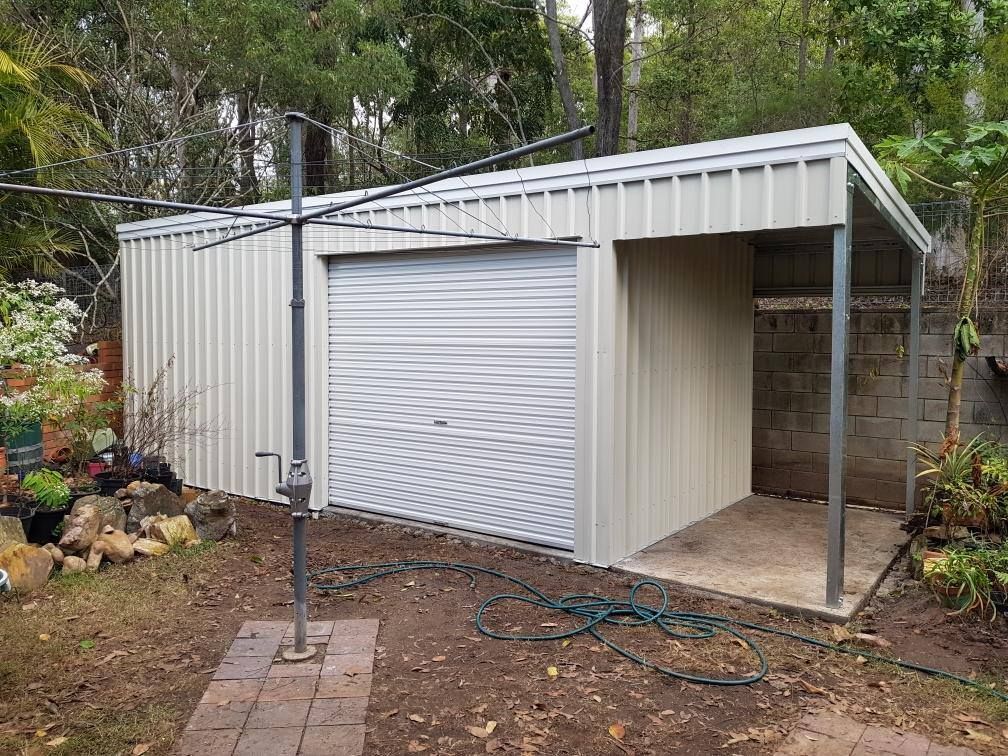 A white garage with a clothesline in the backyard. — Just Sheds In Brendale, QLD