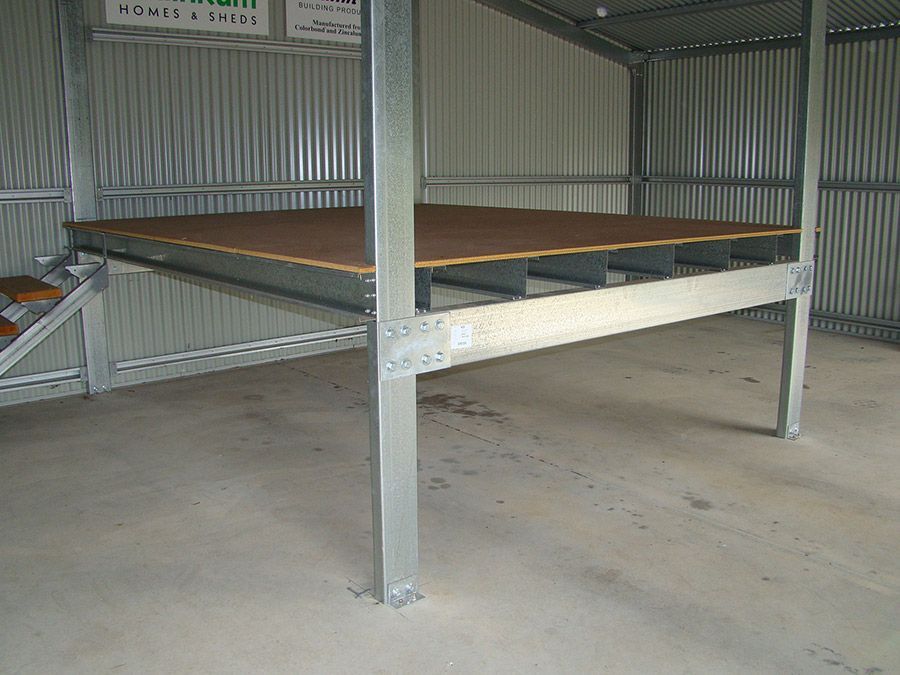 A Metal Structure With a Wooden Floor and Stairs — Just Sheds In Kunda Park, QLD