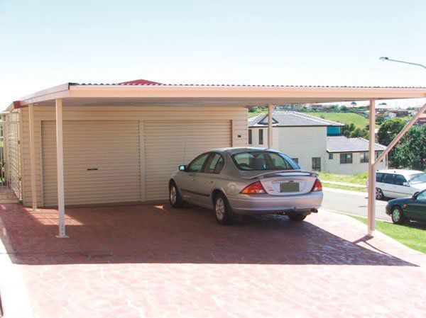 A Car is Parked Under a Canopy in Front of a Garage — Just Sheds In Kunda Park, QLD