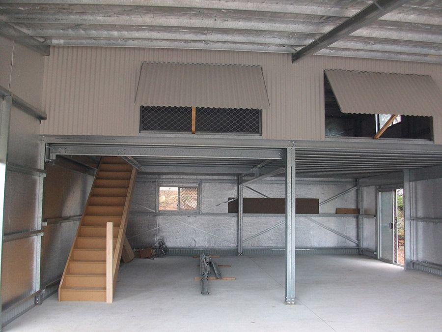 An Empty Building With Stairs Leading Up to the Second Floor — Just Sheds In Kunda Park, QLD