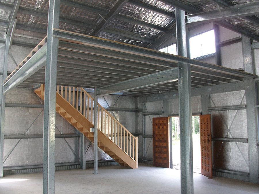 An Empty Building With a Staircase Leading Up to the Second Floor — Just Sheds In Kunda Park, QLD