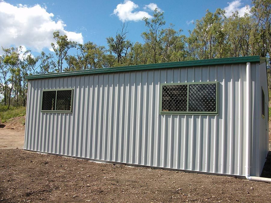 A Gray Building With a Green Roof and Two Windows — Just Sheds In Kunda Park, QLDD