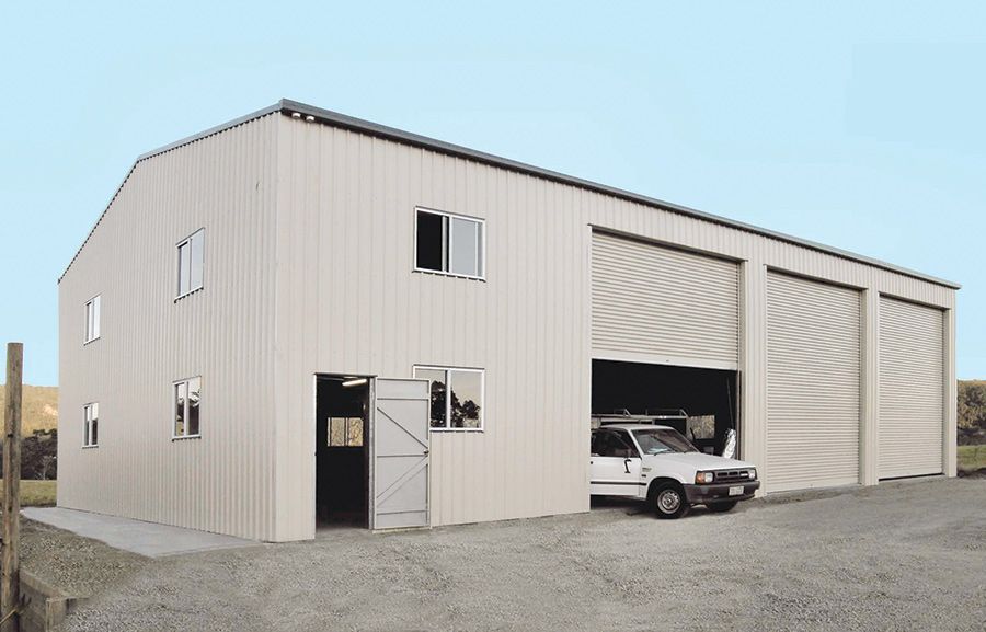 A White Van is Parked in Front of a Large Building — Just Sheds In Kunda Park, QLD