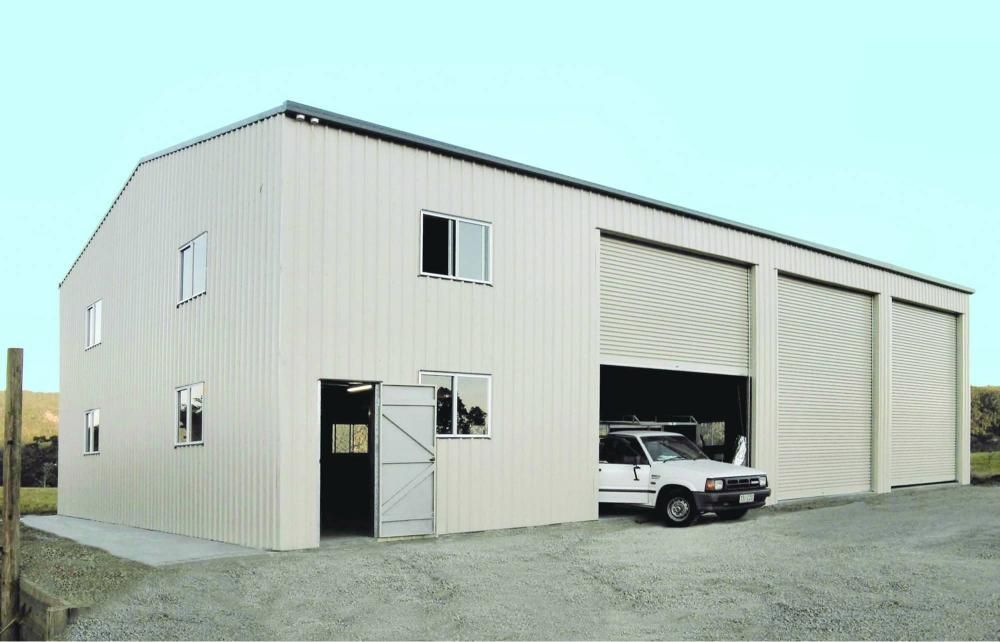 A White Truck Is Parked In Front Of A Large Building — Just Sheds In Kunda Park, QLD