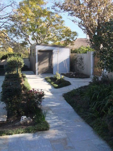 A Walkway Leading to a Shed in a Garden — Just Sheds In Kunda Park, QLD