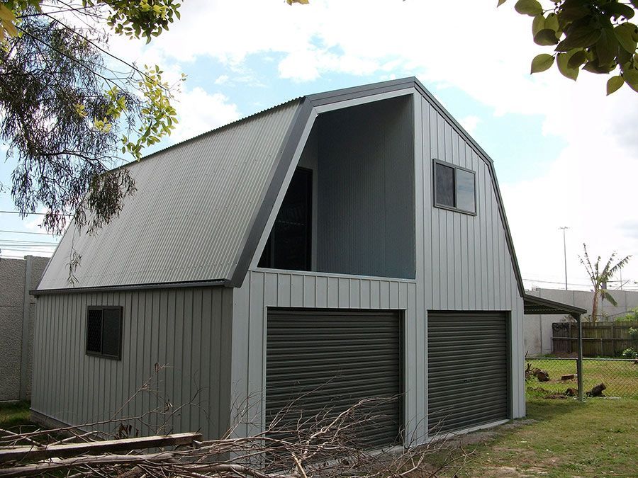A Garage With a Slanted Roof and Two Garage Doors  — Just Sheds In Kunda Park, QLD