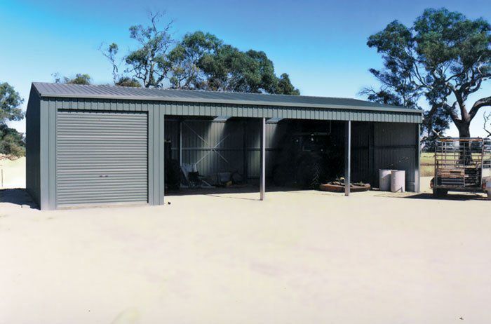 A Gray Garage With a Golf Cart Parked in Front of It — Just Sheds In Kunda Park, QLD
