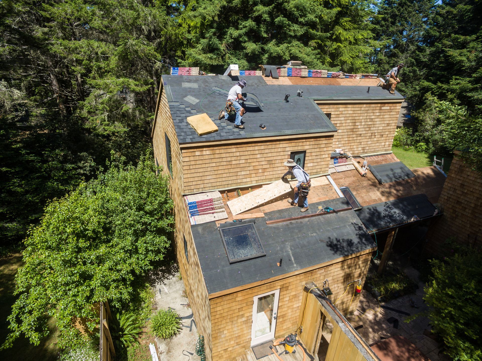 Residential roofing contractors installing a new roof. Residential roofing contractors installing a new roof.