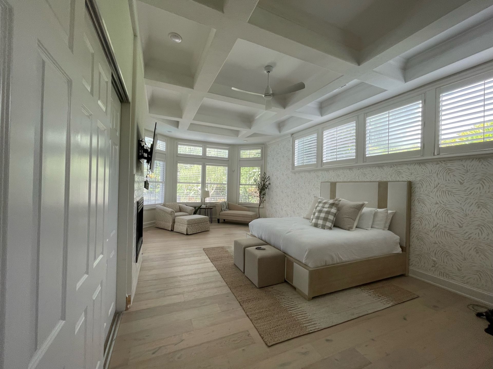 2025 Maitland bedroom trends: coffered ceilings, bay windows, white king bed, and hardwood floors