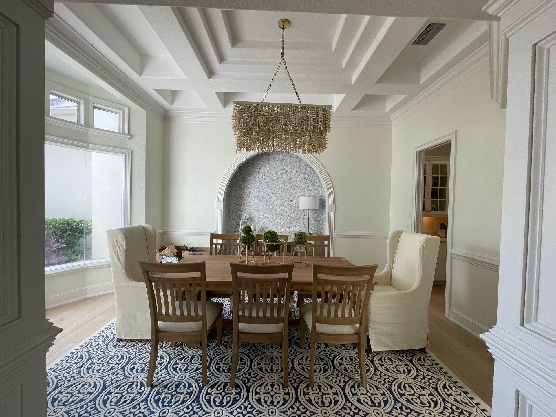 Elegant dining room with pet-friendly flooring and open design.