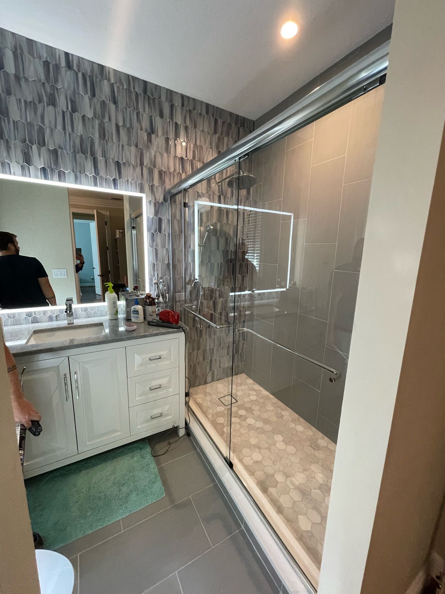 A bathroom with a sink toilet and bathtub