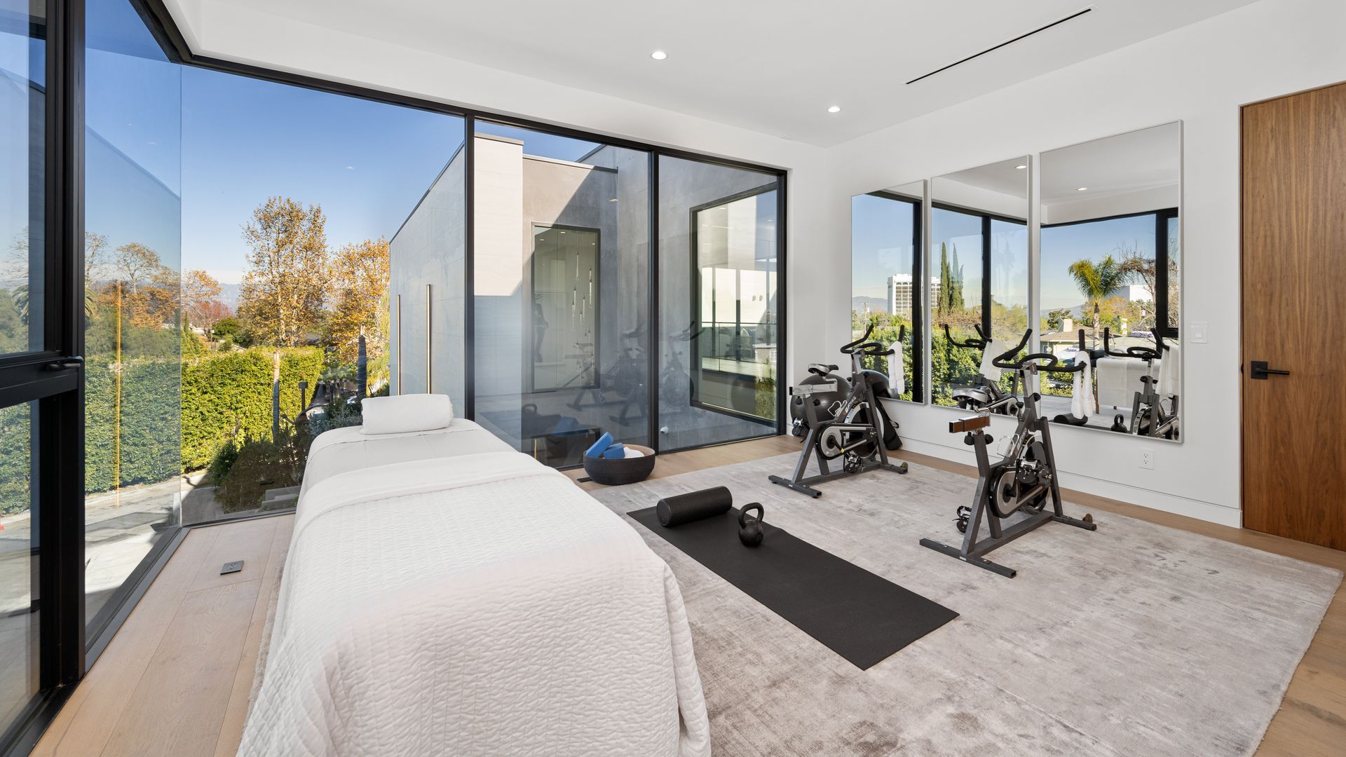 Luxury home gym with integrated recovery sauna and steam space in Central Florida remodel