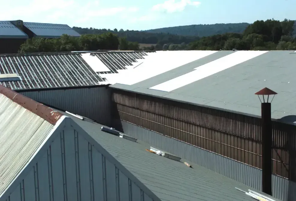 View of multiple industrial roofs with varying textures
