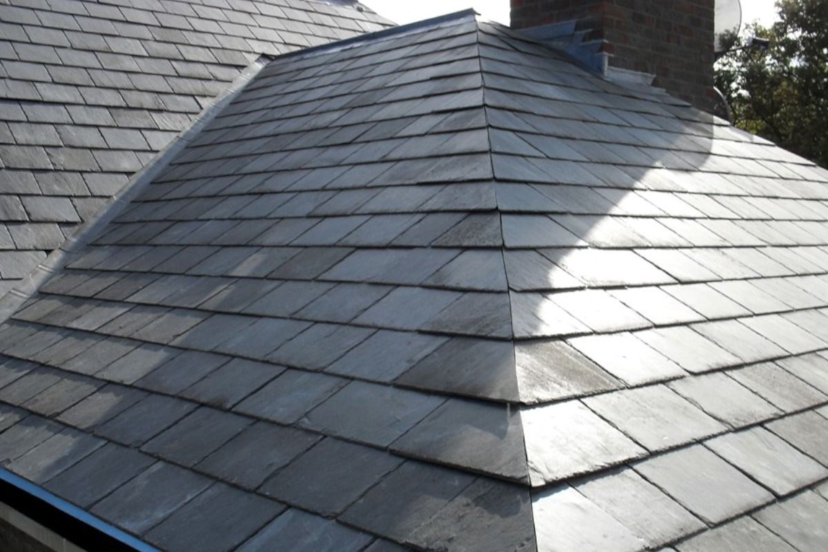 Slate roof with gray tiles, angled view.