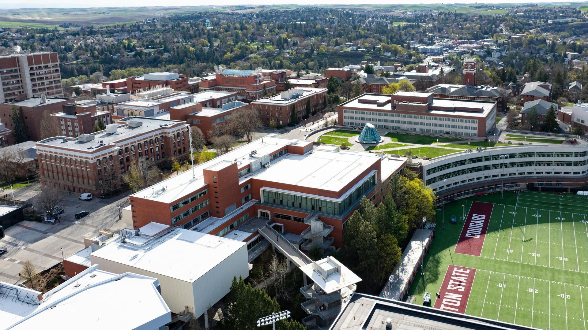Aerial view of a university campus with brick buildings.