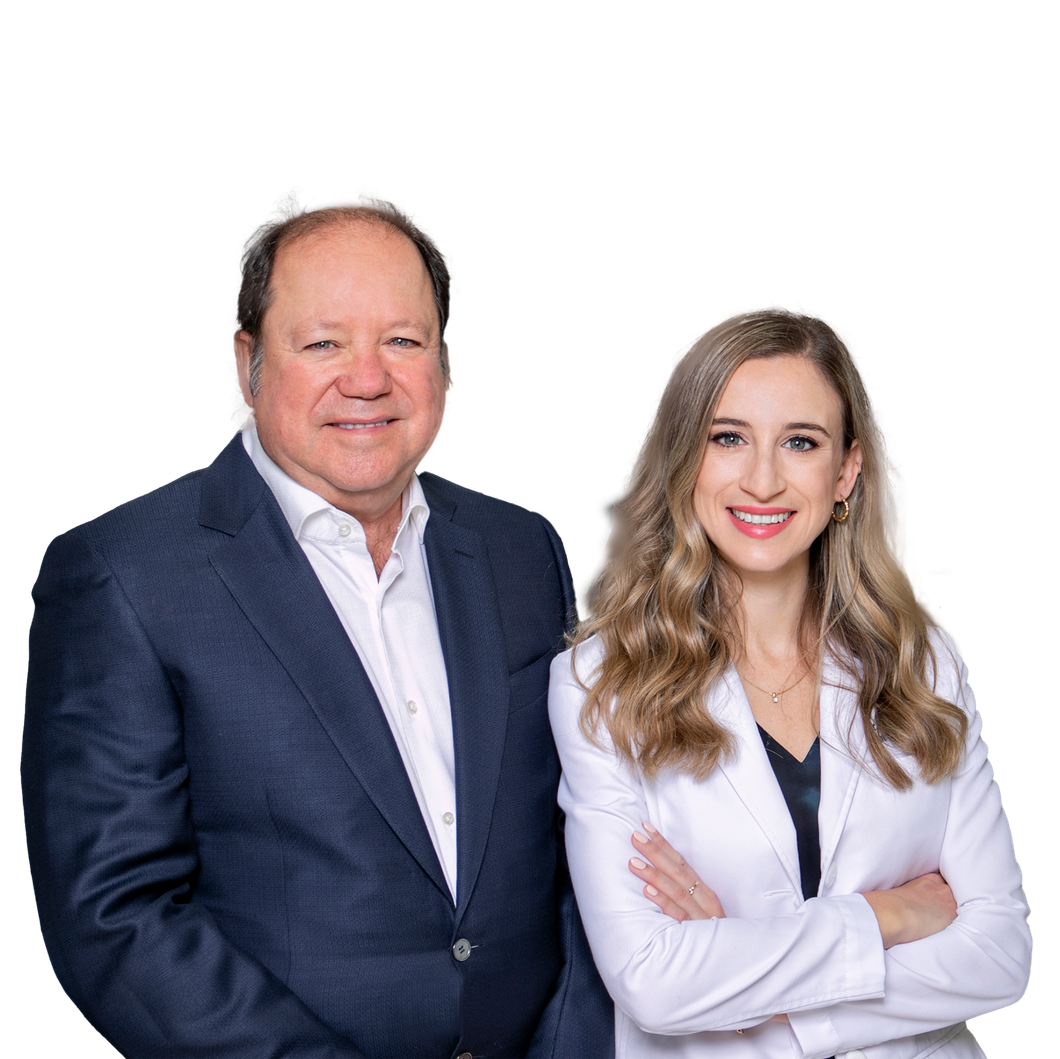 A man and a woman are standing next to each other with their arms crossed.