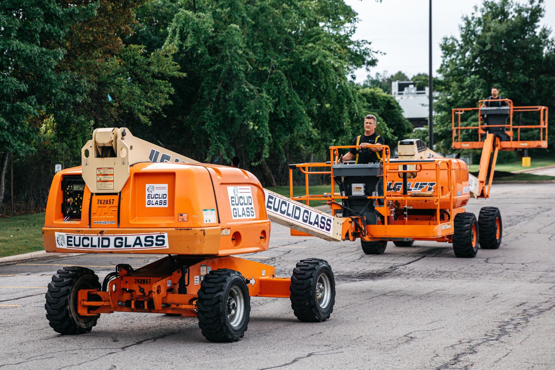 Euclid Glass Orange Tractor — Willoughby, OH — Euclid Glass & Door