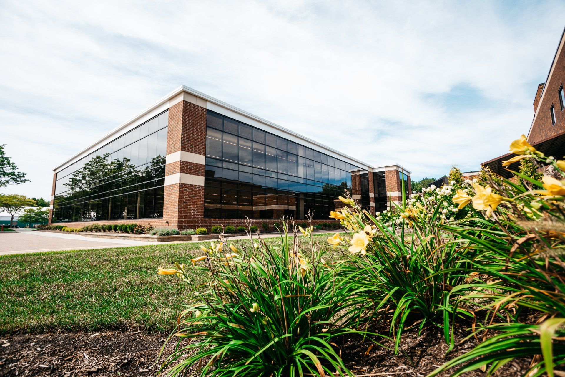 Brown Brick Building With Glass Windows — Willoughby, OH — Euclid Glass & Door