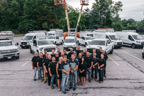Euclid Glass Team in Front of Their Fleet — Willoughby, OH — Euclid Glass & Door