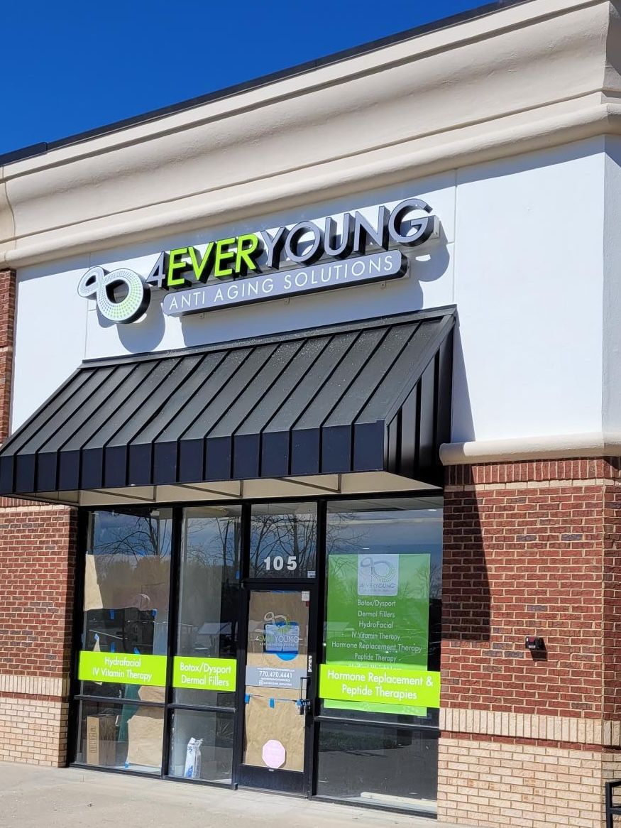 A store front with a black awning and a sign that says `` so every young ''.