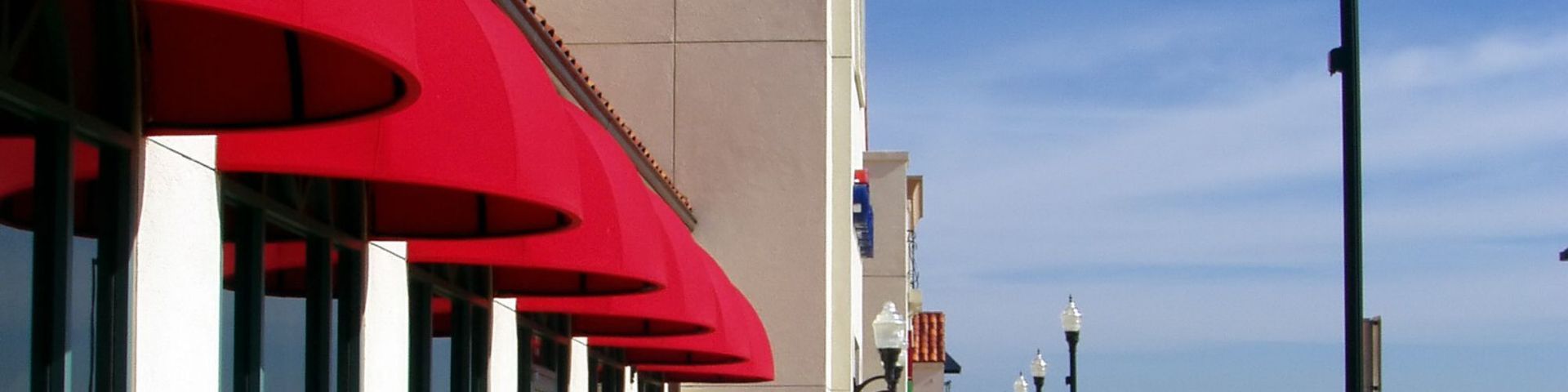 a sign for earl of sandwich is lit up at night .