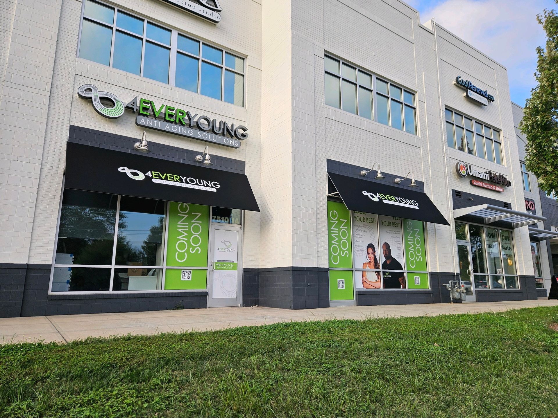 A large building with a lot of windows and awnings.