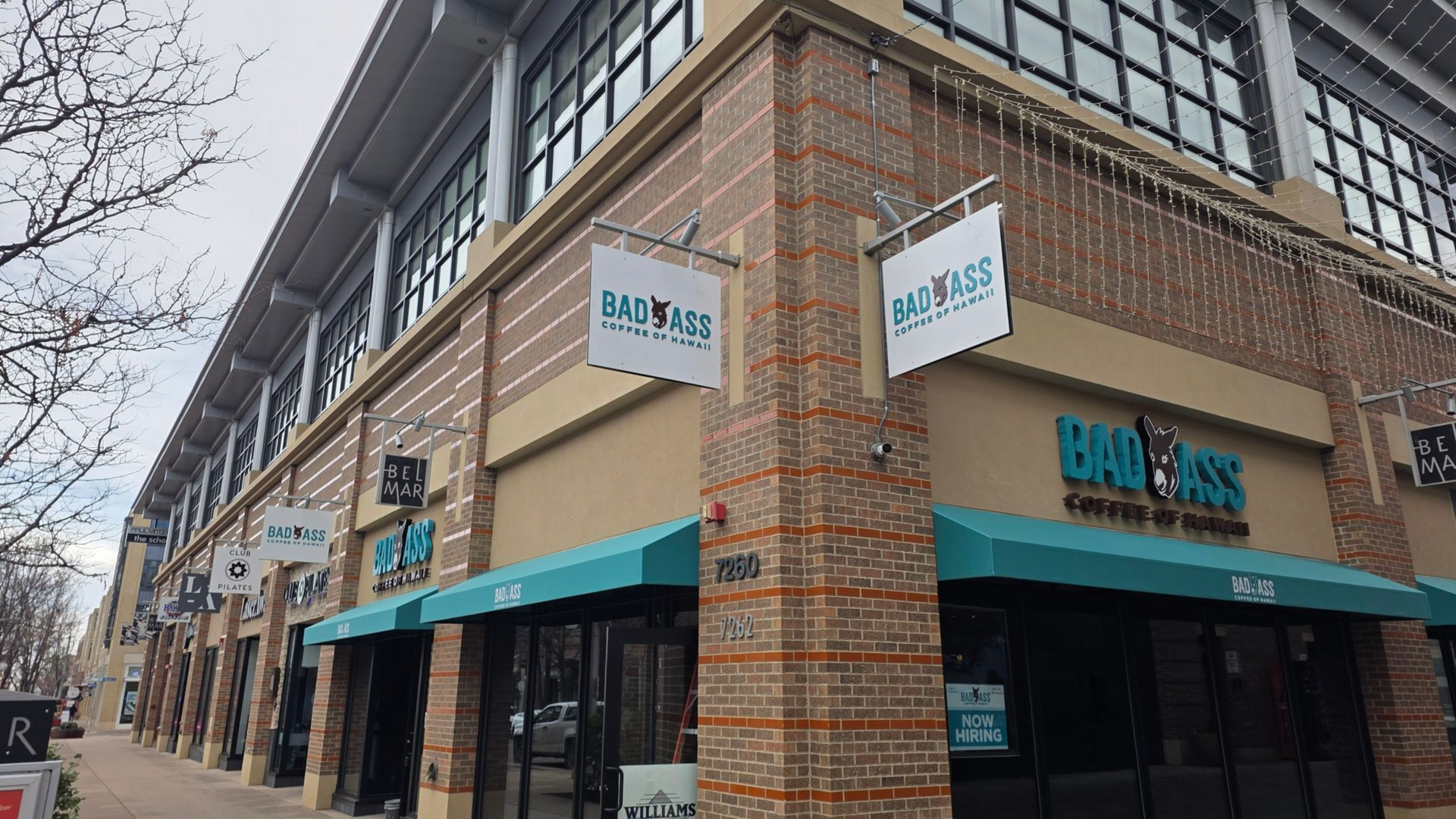 Corner storefront with signs for 