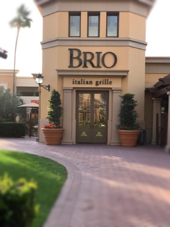 A building with a sign that says brio italian grille