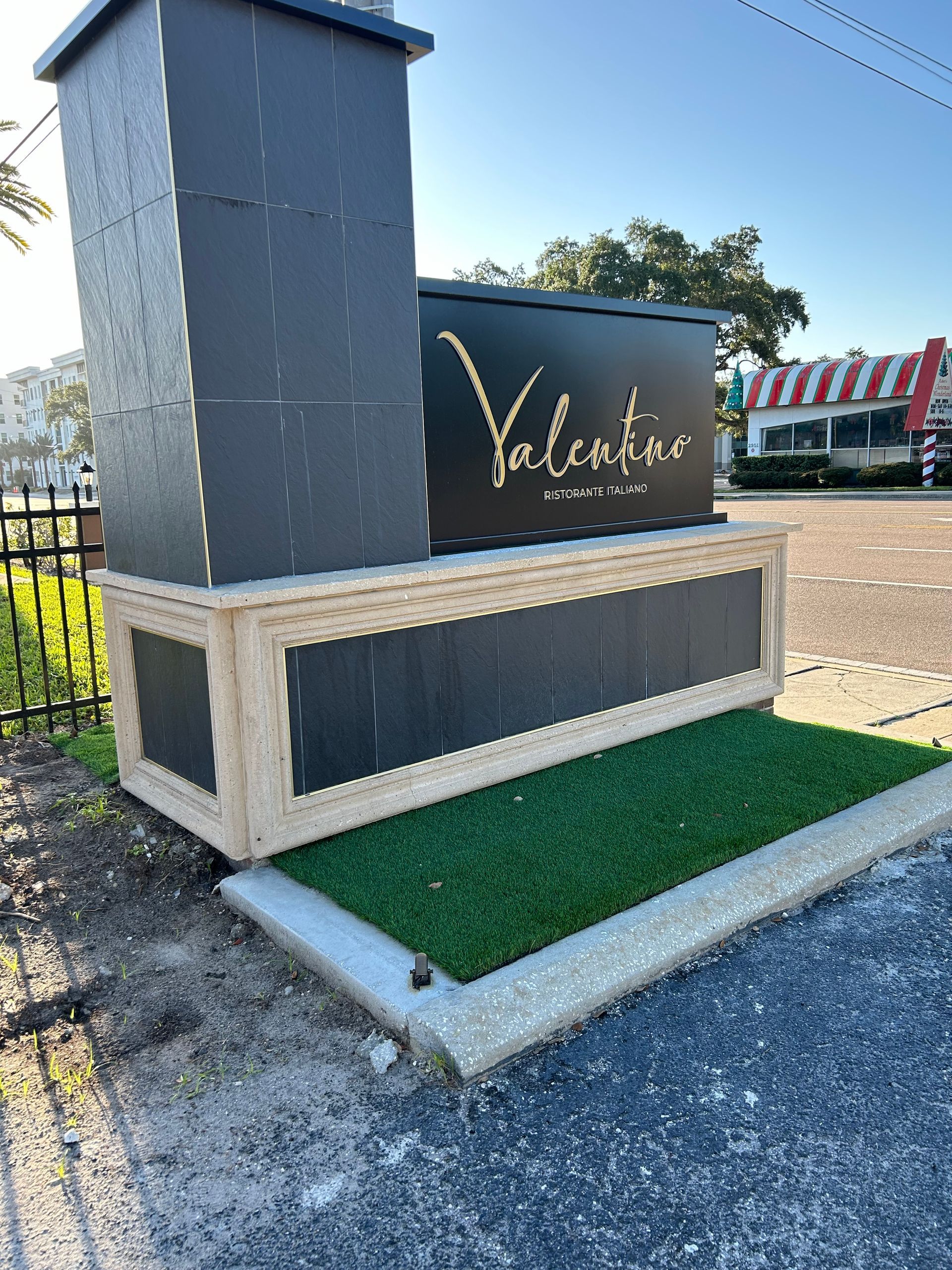 A large black sign that says valentine on it