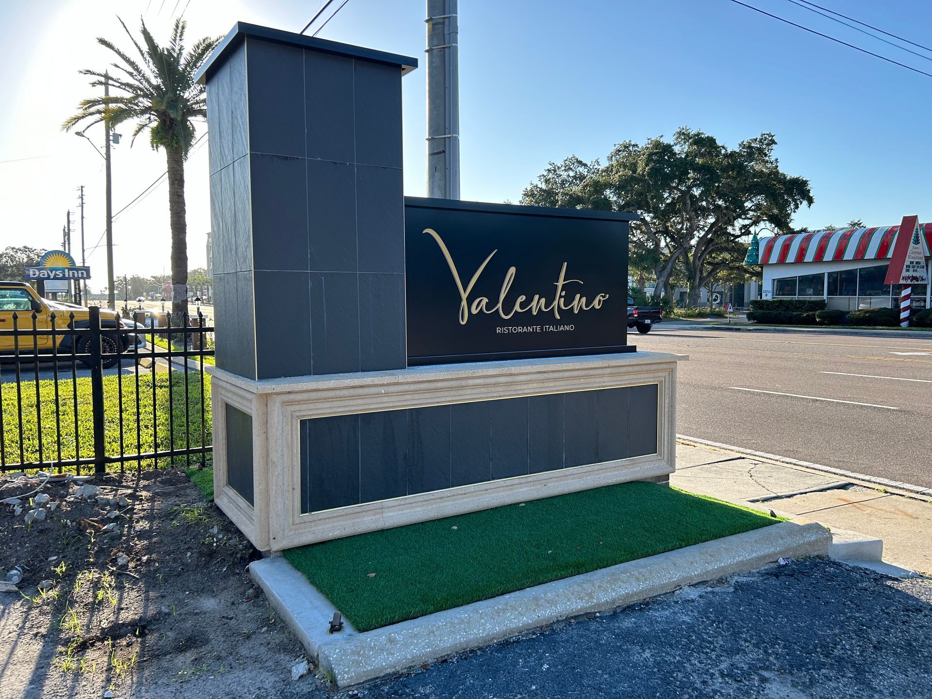 A large black sign that says valentine on it