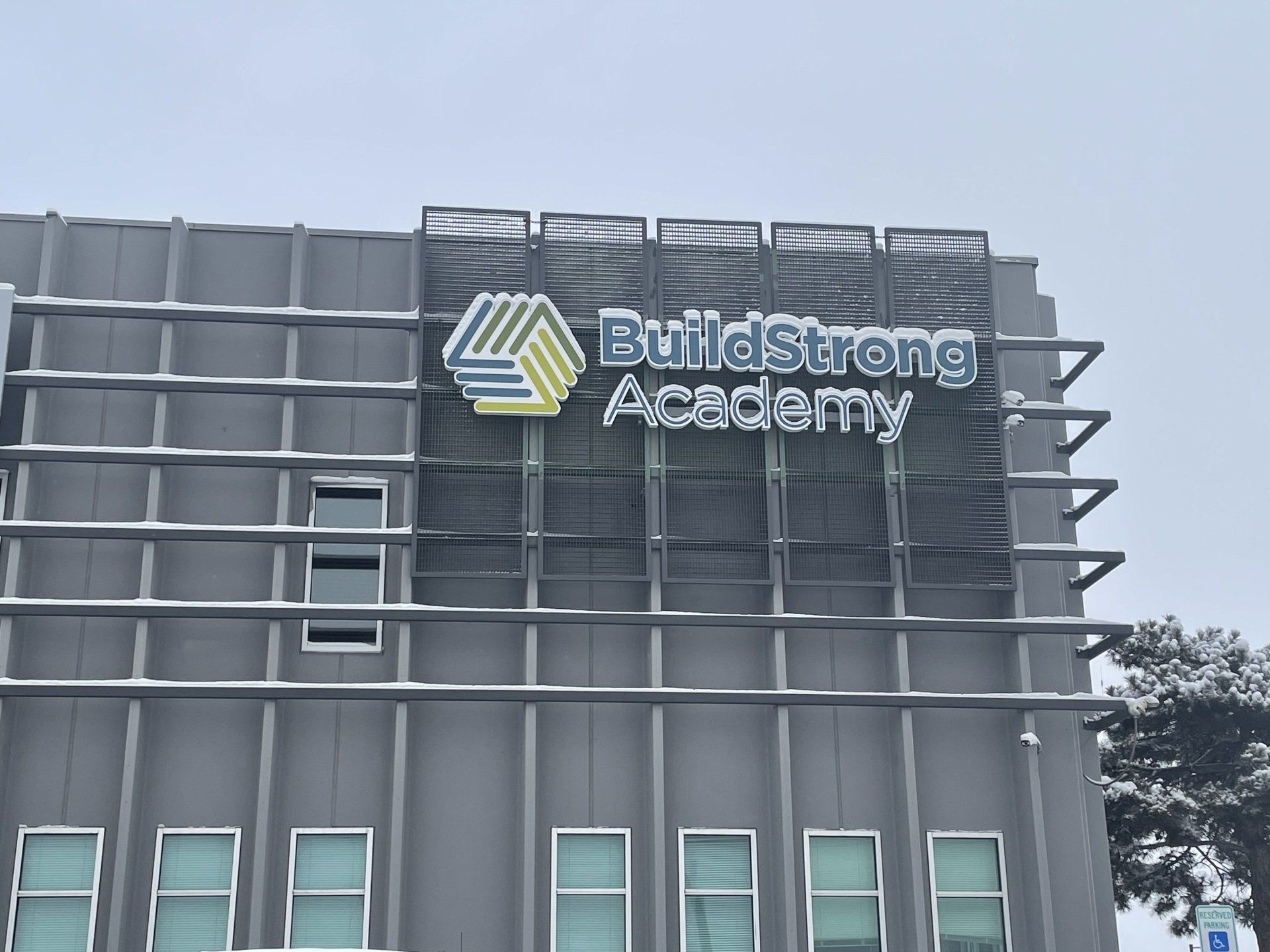 A building with a sign that says battlestrong academy