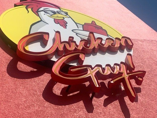 A sign that says chicken guy on it