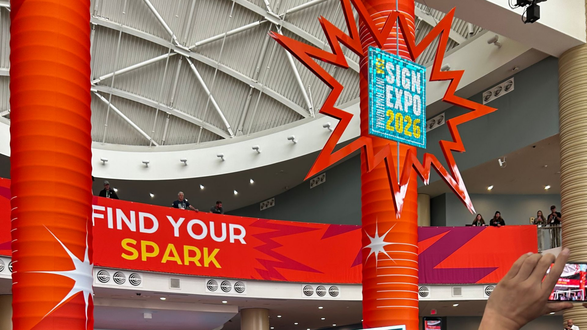 A Sign Expo 2024 banner with the slogan