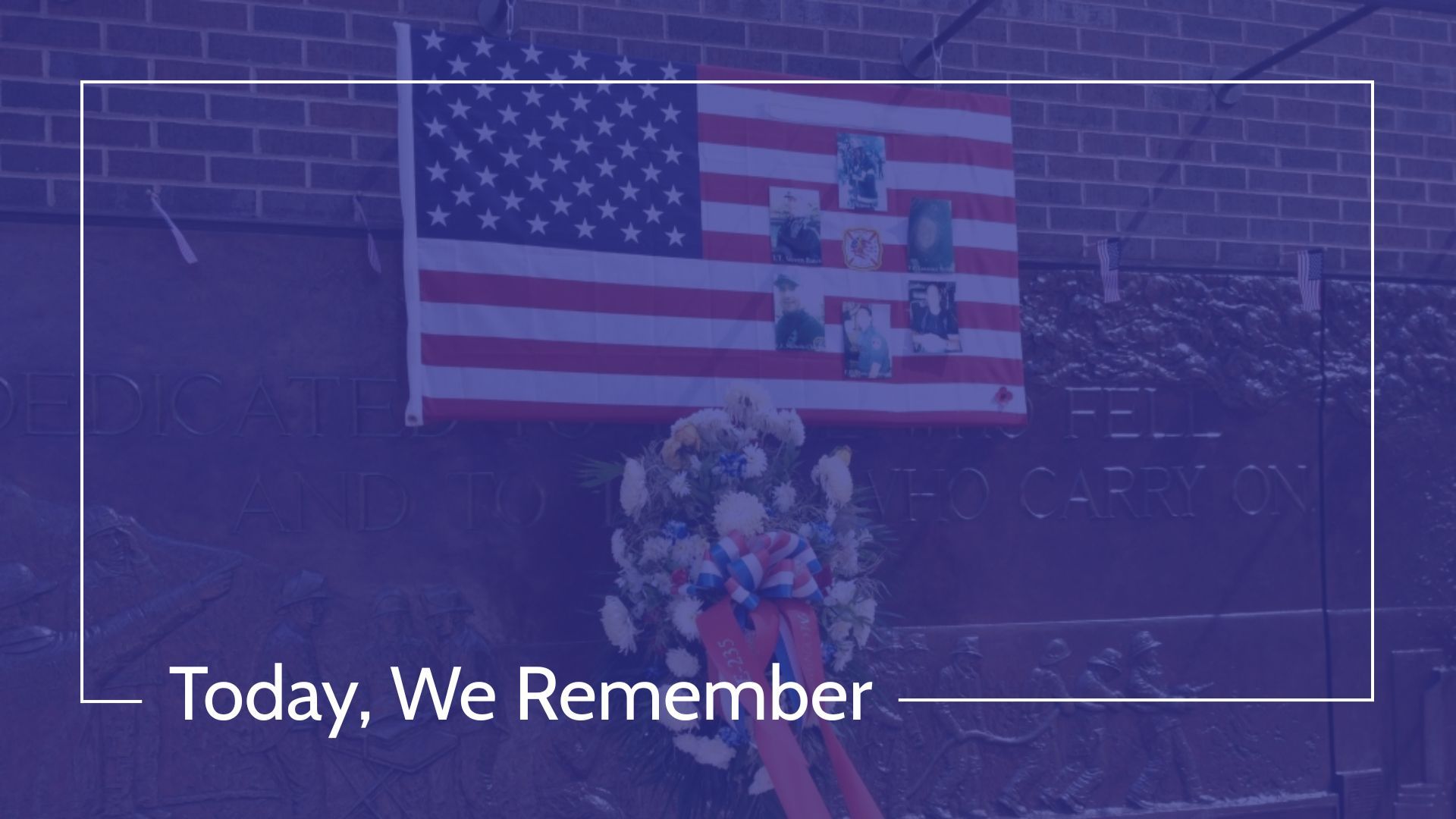 American flag and wreath on a brick wall, photos of people attached, text reads 