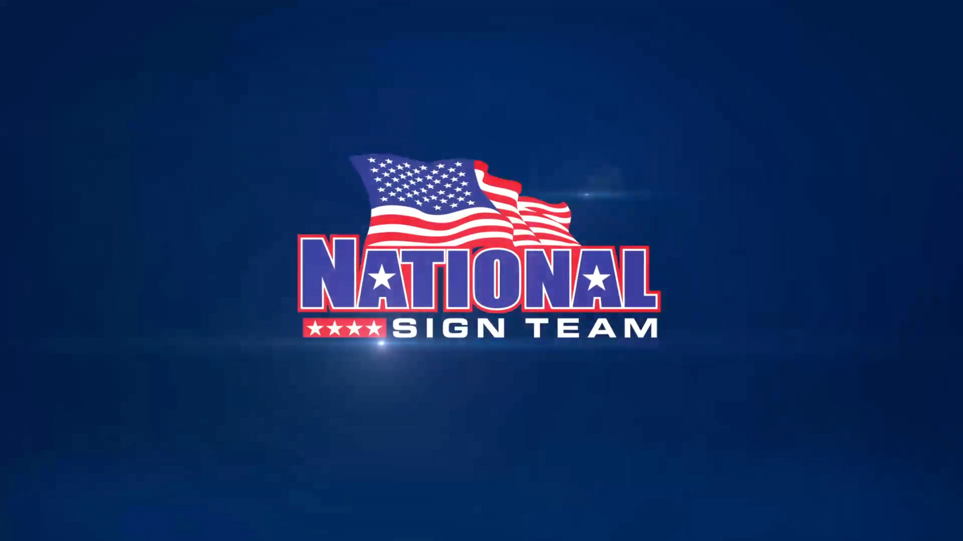 A national sign team logo with an american flag on a blue background.