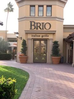 A building with a sign that says brio italian grille
